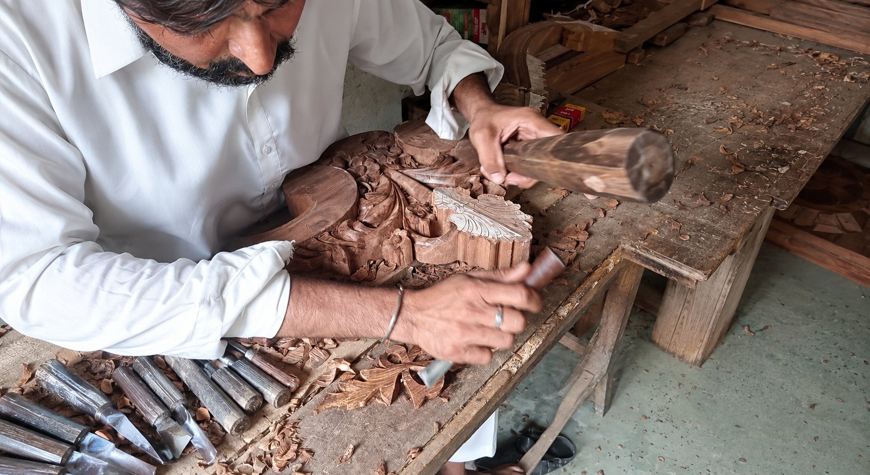 ZS Banquet Supply master craftsman hand-carving Sheesham wood — Karachi, Pakistan